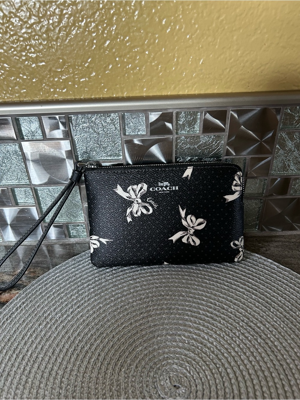 COACH Black Wristlet with White Bow Print